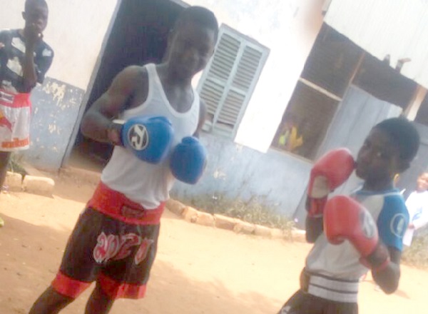 Daniel Selasi Gorsh (left) with a young sparring partner